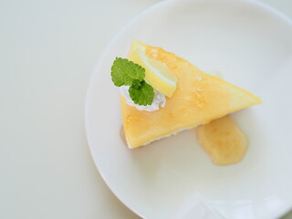 lemon pie on a white plate top view