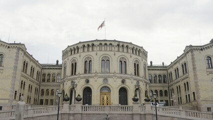 Fototapeta na wymiar Buildings of the Parliament of Norway. Action.Old white stone building,Storting Monument
