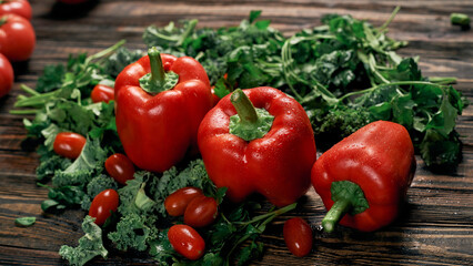 red bell pepper on a wooden kitchen board.
