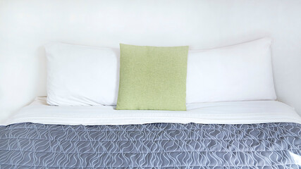 White cushion and white pillow which Modern bedroom interior with a stylish combination of trendy...