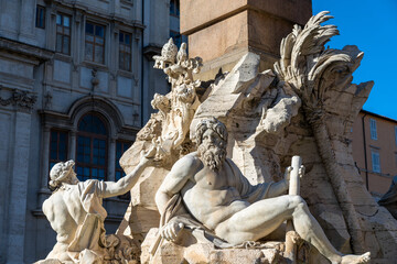 close-up view of the sculptures of the Fountain of the Four Rivers at the Piazza di Navona Square in downtown Rome