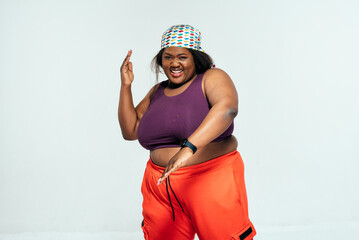 Young woman dancing and making functional training at the gym