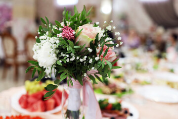 Wedding bouquet on the festive table