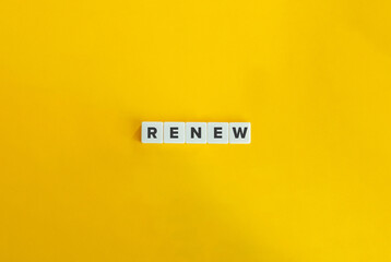 Renew Word on Letter Tiles on Yellow Background. Minimal Aesthetics.