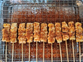 Grilled skewers seasoned with spicy and numbing mala spices, served hot and flavorful. The skewers offer a mouth-tingling taste experience typical of Sichuan cuisine, with a mix of meats 