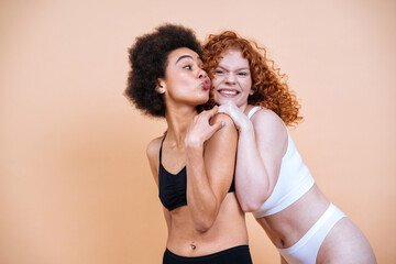 beauty image with two young women with different skin and body