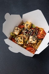 Delicious wok noodles box container. Chinese and asian takeaway fast food.
