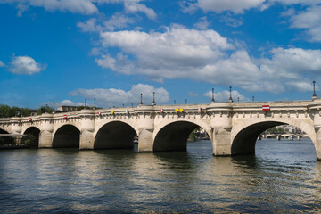 Fototapeta na wymiar View of the Pont Neuf over the Seine river in Paris. It is the oldest bridge in the city.