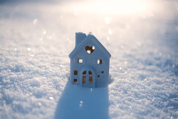 Winter solstice in snowy forest or park natural scene. Hibernal solstice. Toy house and Sparkling...