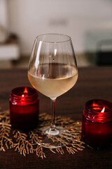 Red Wine glass with a candle mockup; add your own logo or text