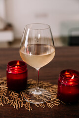 Red Wine glass with a candle mockup; add your own logo or text