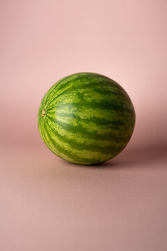whole watermelon on rose soft background 