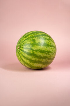 whole watermelon on rose soft background 
