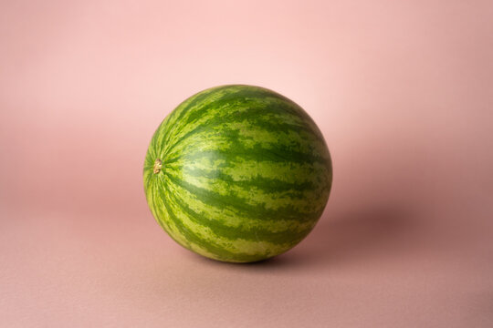 whole watermelon on rose soft background 