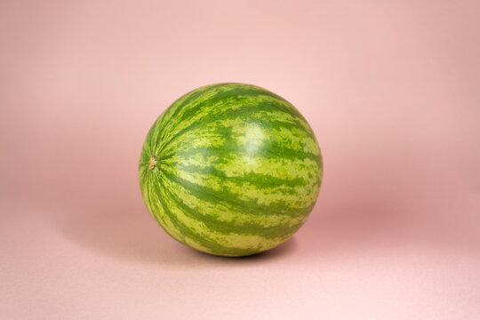 whole watermelon on rose soft background 