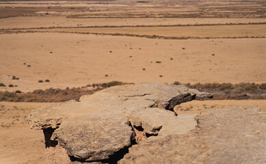 Plain rock viewpoint to the crops, focus on rock