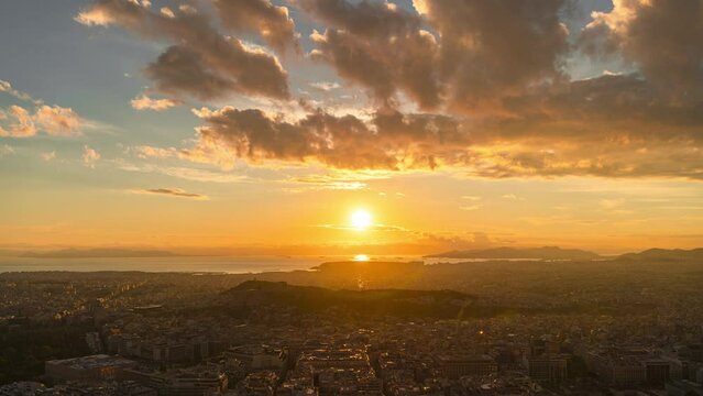 Time lapse of sunset over the Greek city of Athens with view on the Acropolis seen from Lycabettus hill viewpoint