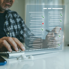 Man do online exam on virtual screen. Answer a survey filling out a tech form. Quiz, test concept.
