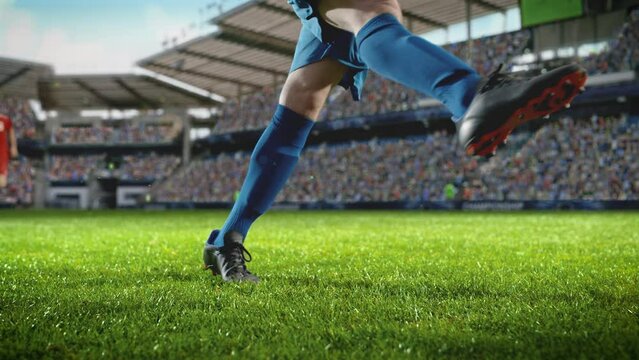 Football World Championship: Soccer Player Runs, Kicks the Ball. Ball Shoots, Grass Sprays Outwards, Full Stadium Crowd Cheers. Camera Moves in Arc Super Slow Motion. Cinematic Shot Captures Victory