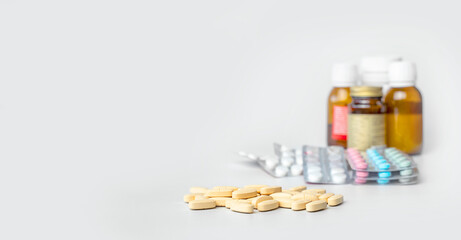 Set of various drugs, pills, tablets, bottles of mixture, syrups, vitamins in season of colds and flu over white background. Concept of healthy lifestyle and treatment. Copy space for advertisement.