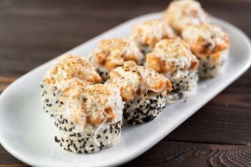 Sushi roll. Sushi with scallop, avocado, cream cheese and sesame. Sushi menu. Japanese food.