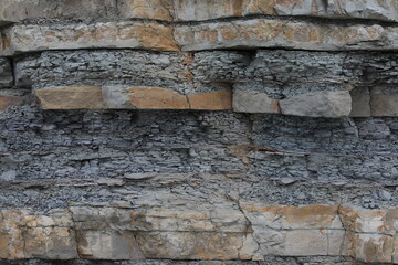 Stone wall part of the mountain.Concept natural rock background texture