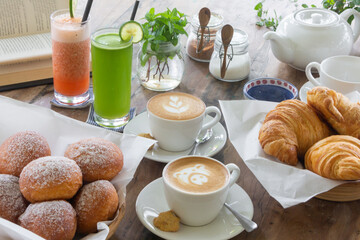 breakfast bakery, fruit juice and cappuccino