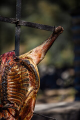 Lamb on the spit, cooked with the traditional Argentine method, La Pampa province, Patagonia,...