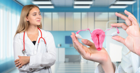 Doctor gynecologist. Woman uterus and ovaries in hands. Referral to doctor for diseases of uterus....