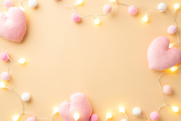 Valentine's Day concept. Top view photo of soft heart shaped toys light bulb garland and fluffy...