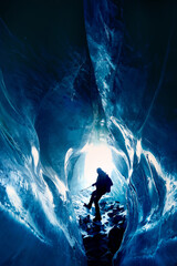 Man exploring an amazing glacial ice cave