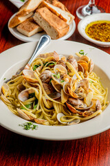 Pasta with clams. Pasta with clams and seafood, Parmesan cheese, spinach, and Italian parsley. Classic American or Italian restaurant favorite. Homemade pasta with tomato sauce, meats and cheeses.