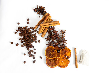 Mixture of spices for winter infusions, cinnamon, star anise, cloves, coffee on a white background