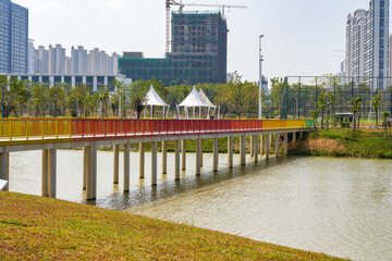 A pedestrian rainbow bridge over the city river