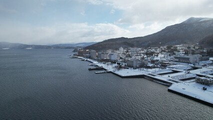 Fototapeta na wymiar Hokkaido, Japan - December 15, 2022: Lake Toya During Winter Season