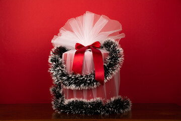 wrapped christmas gift on Red background