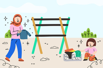 Mother and kids drying clothes in the backyard