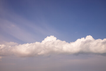 Fototapeta na wymiar White clouds in the blue sky.