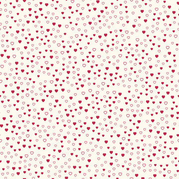 Seamless pattern of small magenta hearts and heart outlines on a cream background.
