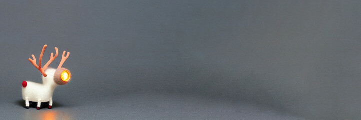 reindeer under x-mas tree at cold snowy place. sky full of star.