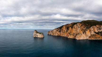 panorama landscape of the cliffs and sea stacks at Porto Flavia on Sardinia