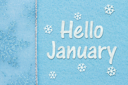 Hello January message with snowflakes on blue felt
