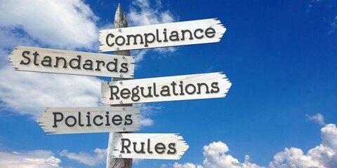 Compliance, standards, regulations, policies, rules - wooden signpost with five arrows © PX Media