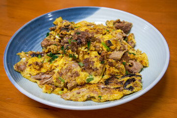A delicious Chinese dish, scrambled eggs with fish offal