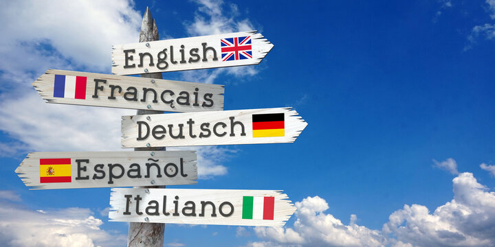English, French, German, Spanish, Italian - wooden signpost with five arrows