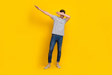 Full length photo of cool funky man wear white t-shirt dancing having fun isolated yellow color background