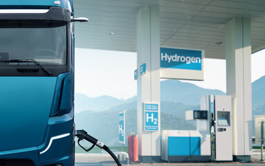Futuristic hydrogen fuel cell truck next to filling station. Eco-friendly commercial vehicle concept