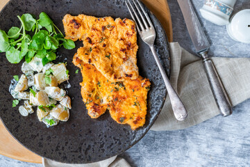 Lemon and thyme pork schnitzel with potato salad