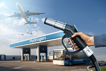 Hand with H2 nozzle on a background of fuel cell bus at the hydrogen filling station and airplane...