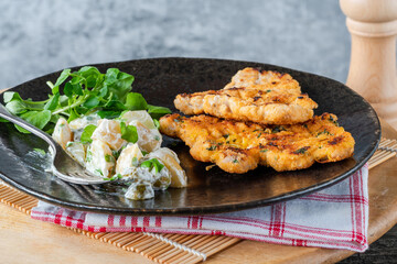 Lemon and thyme pork schnitzel with potato salad